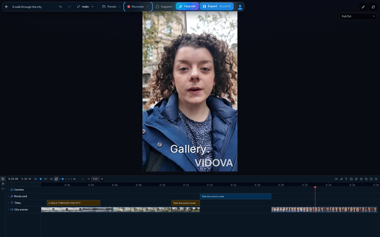 Vidova editor with a vertical 9:16 preview of a woman talking to the camera and the word Gallery as a caption, and the timeline below with camera, route card, titles and video tracks.